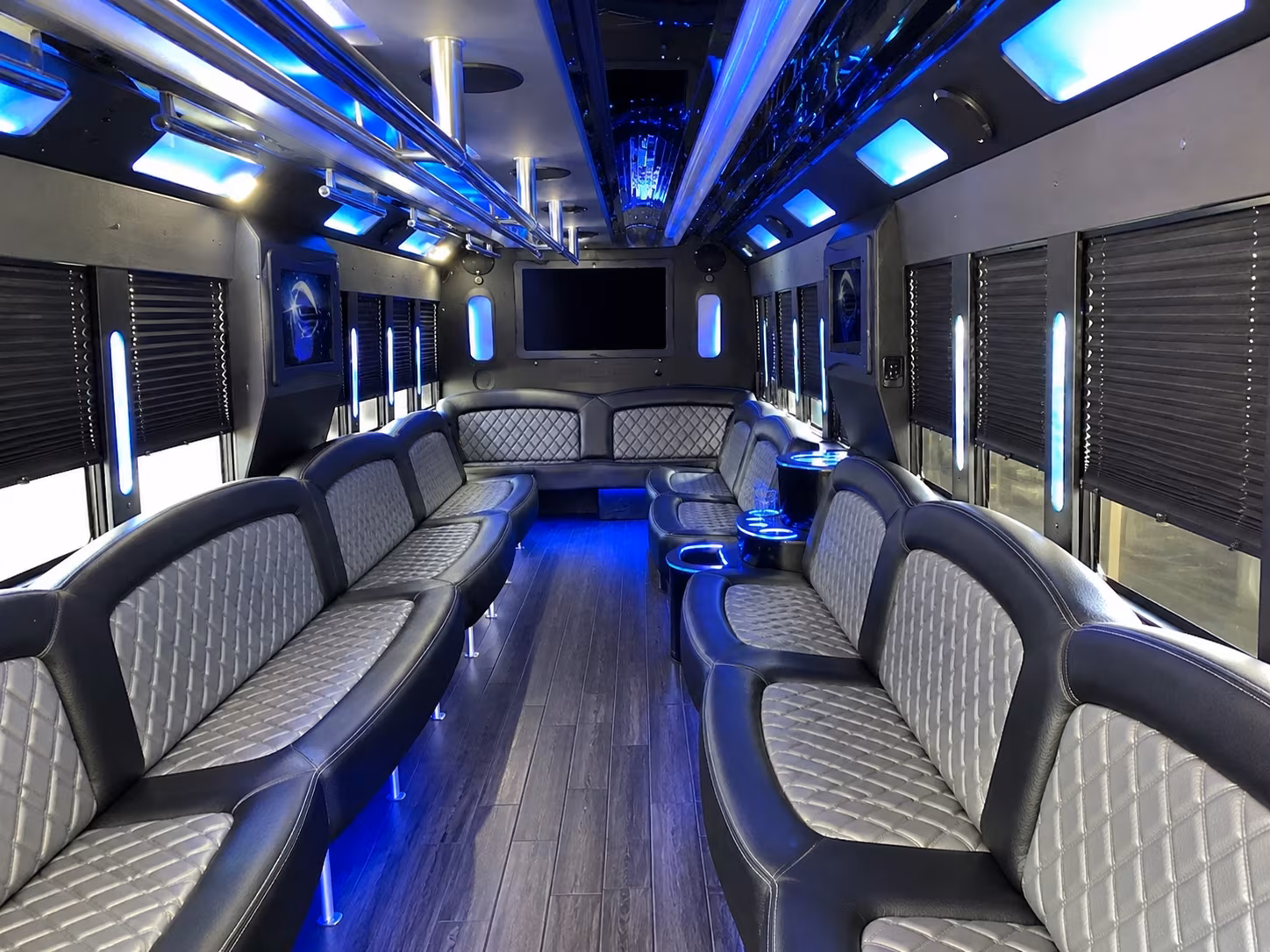 Friends laughing during a party bus celebration in Escondido